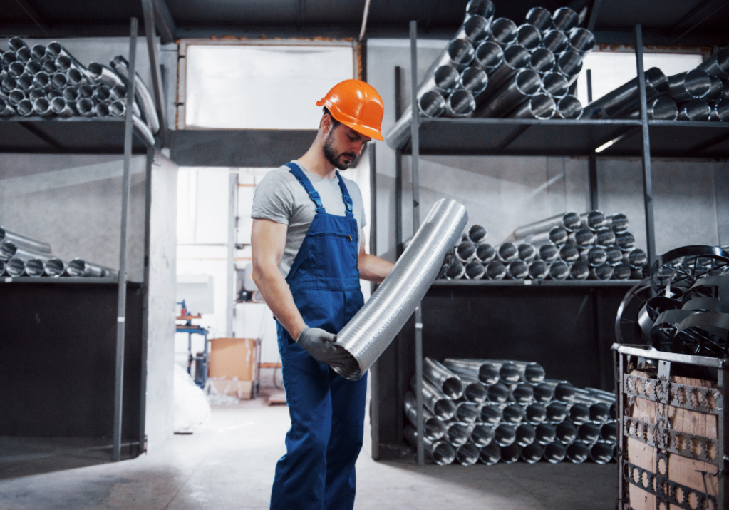 A man holding Steel Pipe